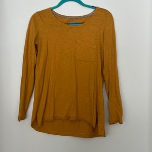 Mustard long sleeve with front pockets and unique hem